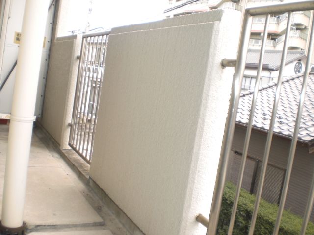 Balcony. Washing machine storage is located in the veranda