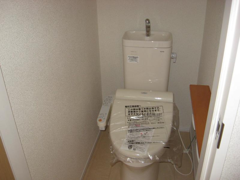 Toilet. Hot water function with toilet