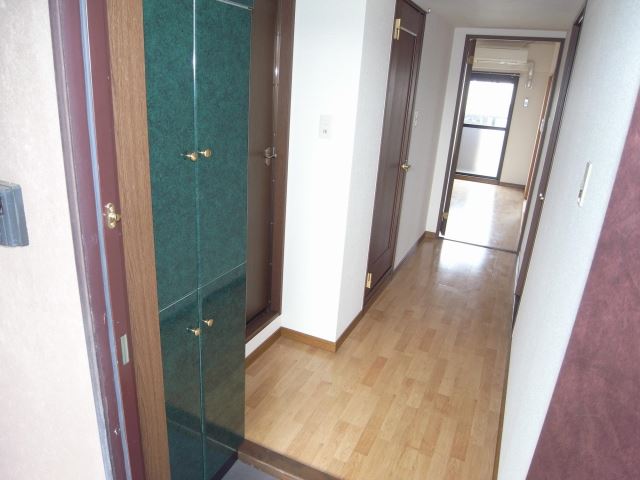 Entrance. With large cupboard