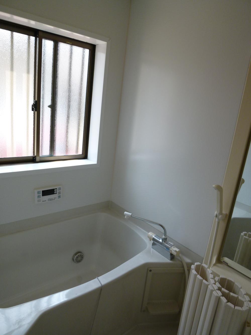 Bathroom. It is the bath of the start of bright sunlight from the window.