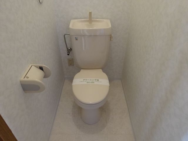 Toilet. Toilet with a towel over