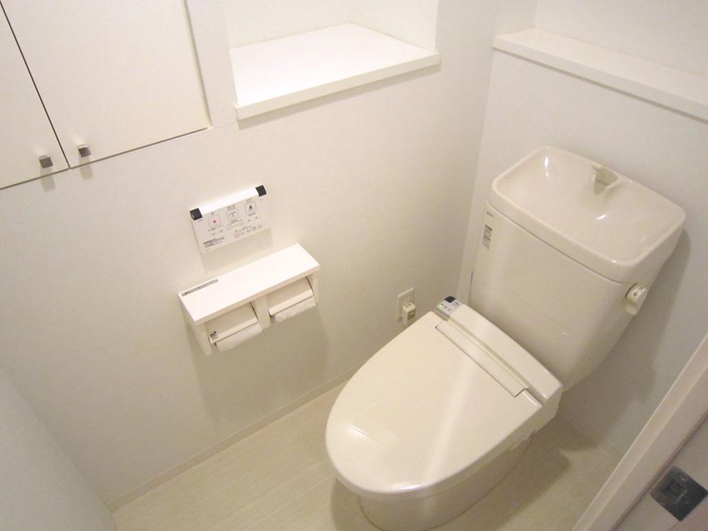 Toilet. It was exchanged a warm water washing toilet seat.