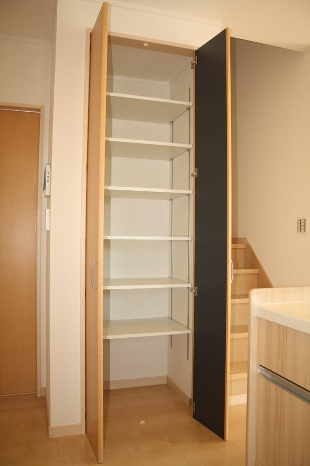Model house photo. Pantry of shelves with