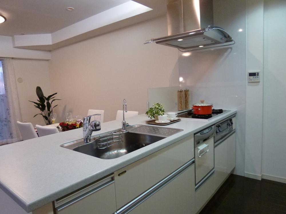 Kitchen. Large wide type of system kitchen work space of dish washing dryer and the water purifier is built-in.
