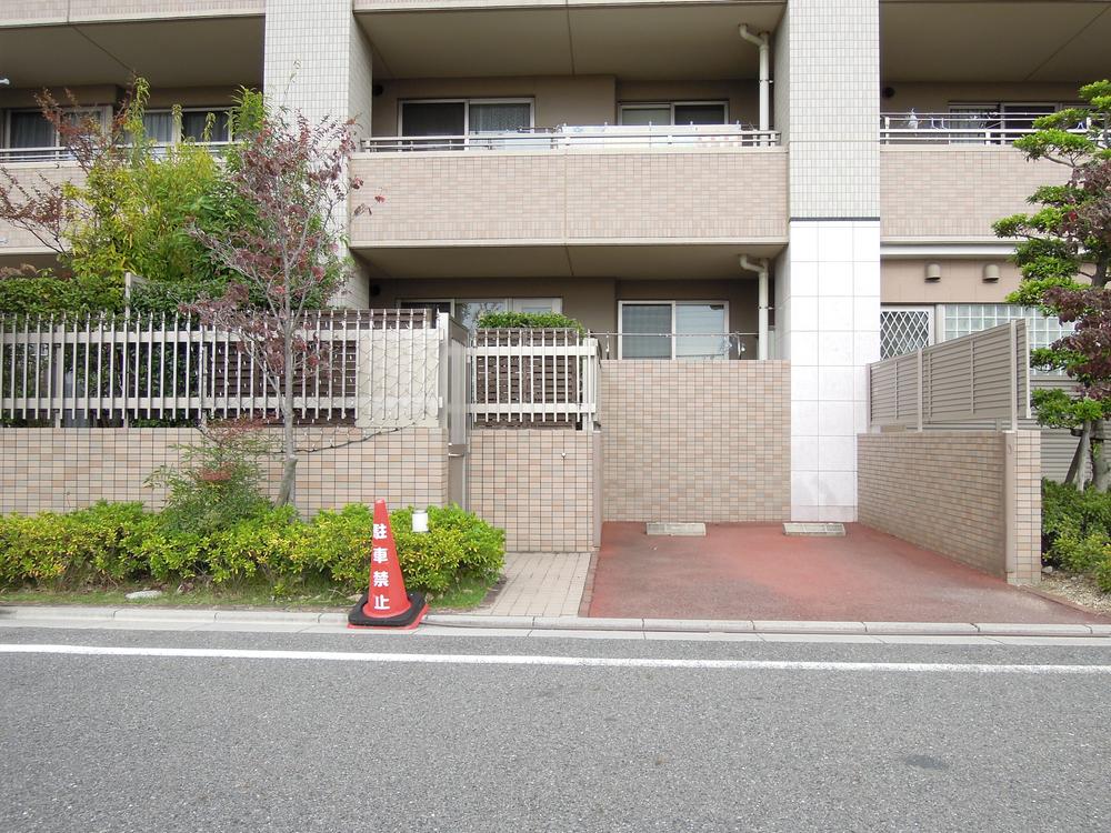 Local appearance photo. Private parking is in front of the room.