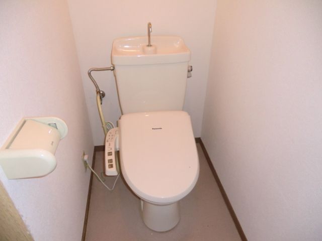 Toilet. It is equipped with toilet with shower!