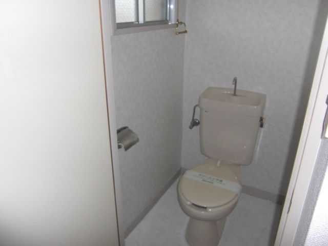 Toilet. It is ventilation easy small window with a toilet