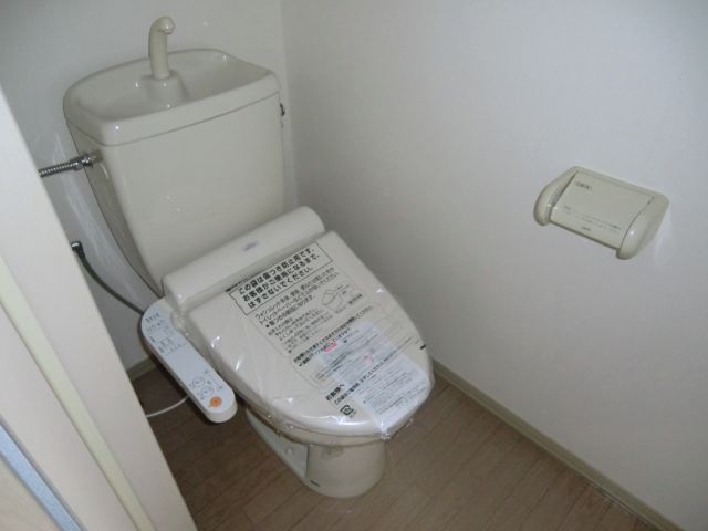 Toilet. Equipped with shower toilet