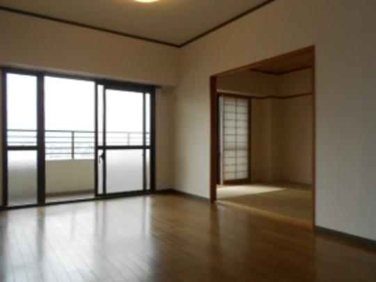 Local appearance photo. Shoot the living dining and a Japanese-style room from the kitchen side.
