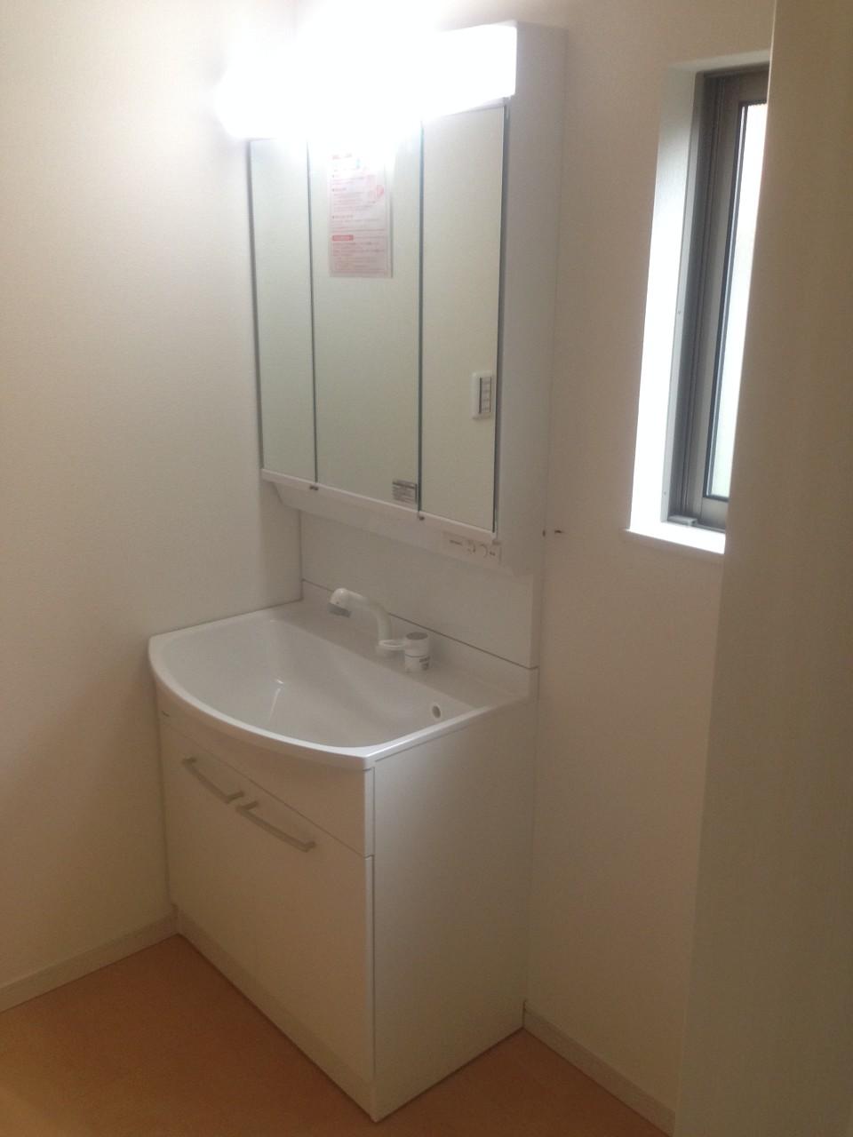 Wash basin, toilet. Washroom with shower! 