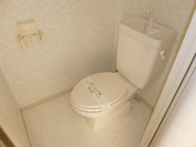 Toilet. North of the room is also bright.