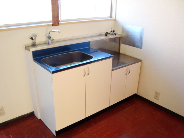 Kitchen. There is a window in front sink