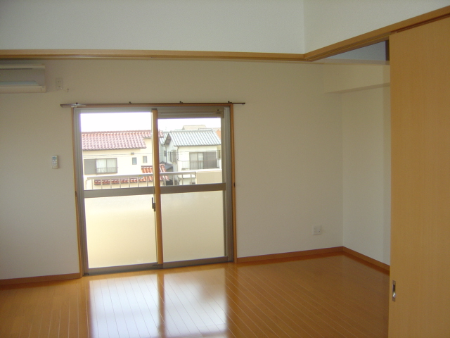 Living and room. South-facing balcony bathed in bright sunshine