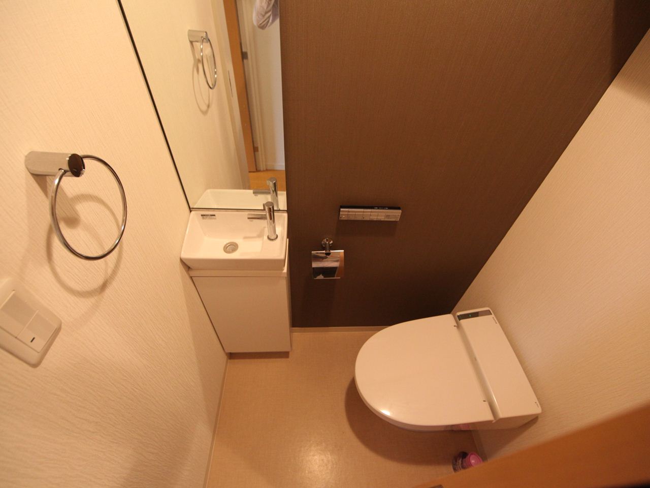 Toilet. Toilet (with washlet) shelf with with hand-washing facilities