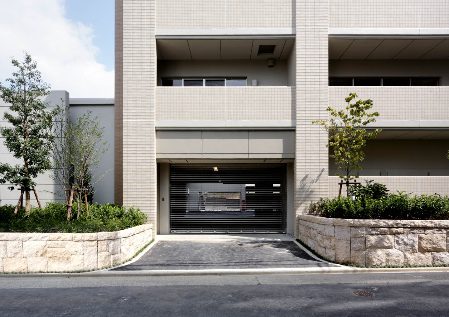 Parking lot. Electric shutter gated parking lot entrance