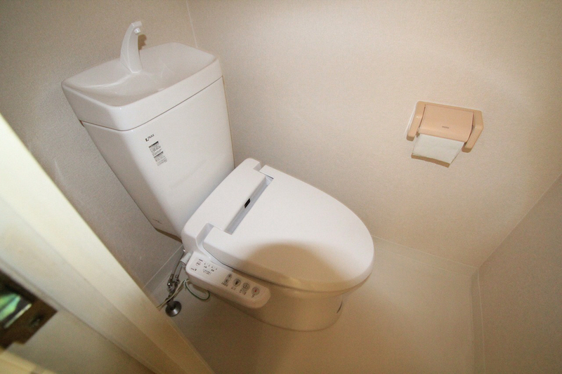 Toilet. It is white with a clean.