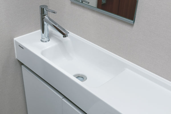 Toilet.  [counter] The toilet is also standard with hand washing counter of smart design (same specifications)