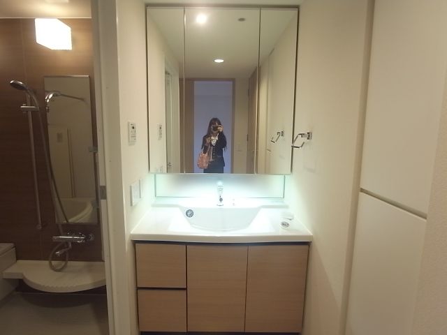 Washroom. It is a wash basin with a large mirror