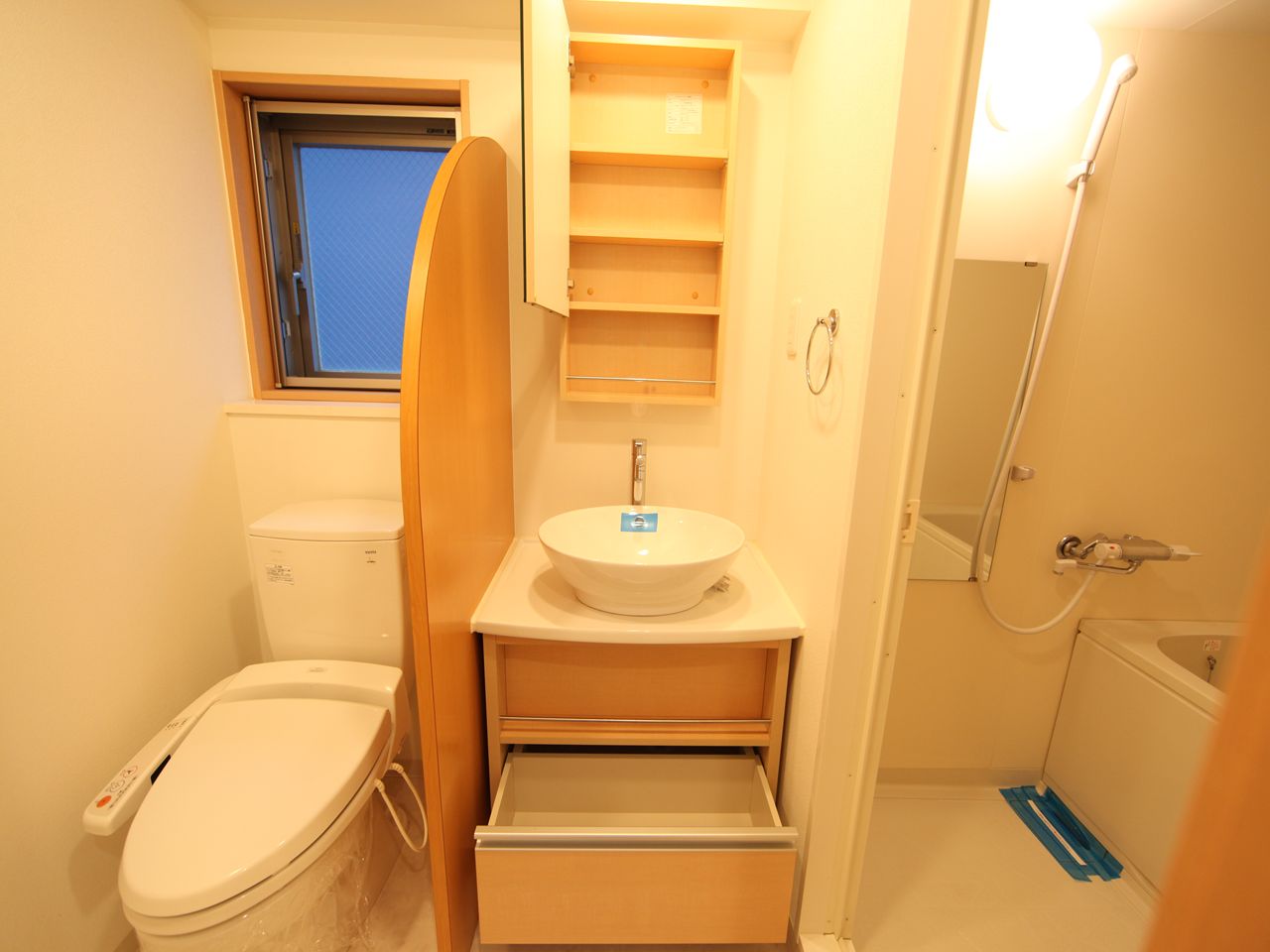 Washroom. Stylish washbasin Toilet with warm water washing toilet seat With window