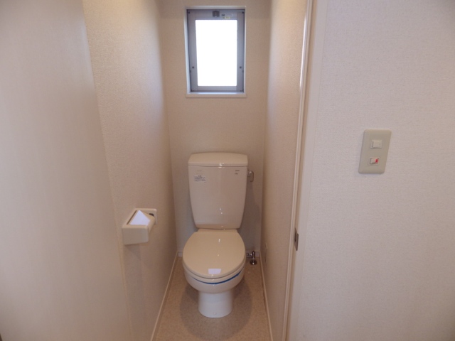 Toilet. It has a window to the toilet