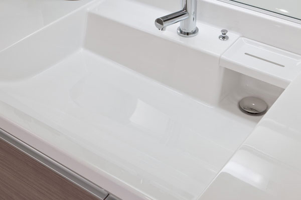 Bathing-wash room.  [Bowl-integrated counter] Basin counter of irregularities small bowl integral is easy to clean. Handy with a wet palette to put wet soap and cup (same specifications)