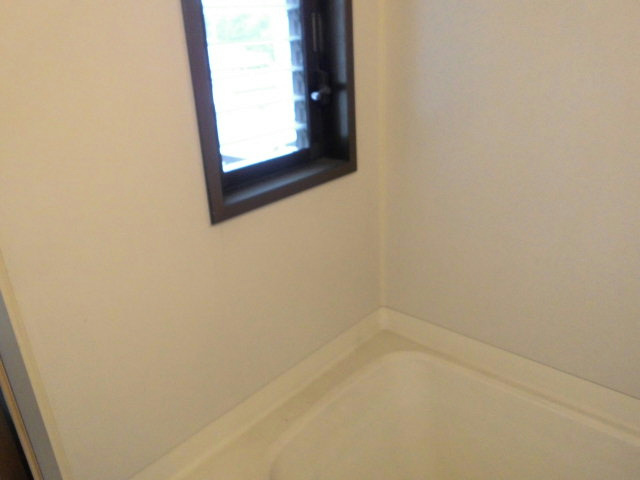 Bath. There is a window in the bathroom