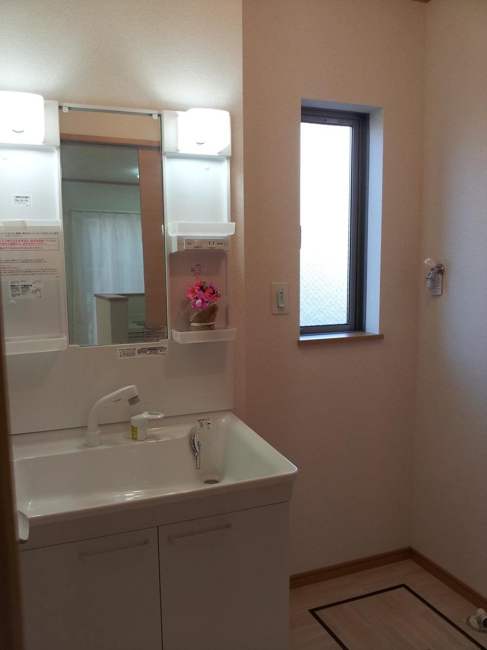 Wash basin, toilet. Washroom