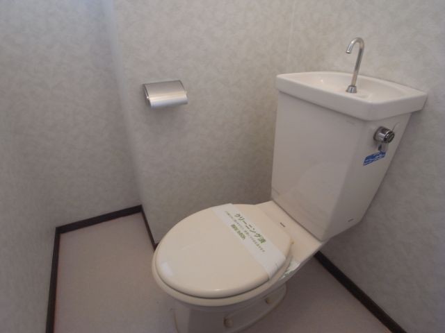 Toilet. There is a window