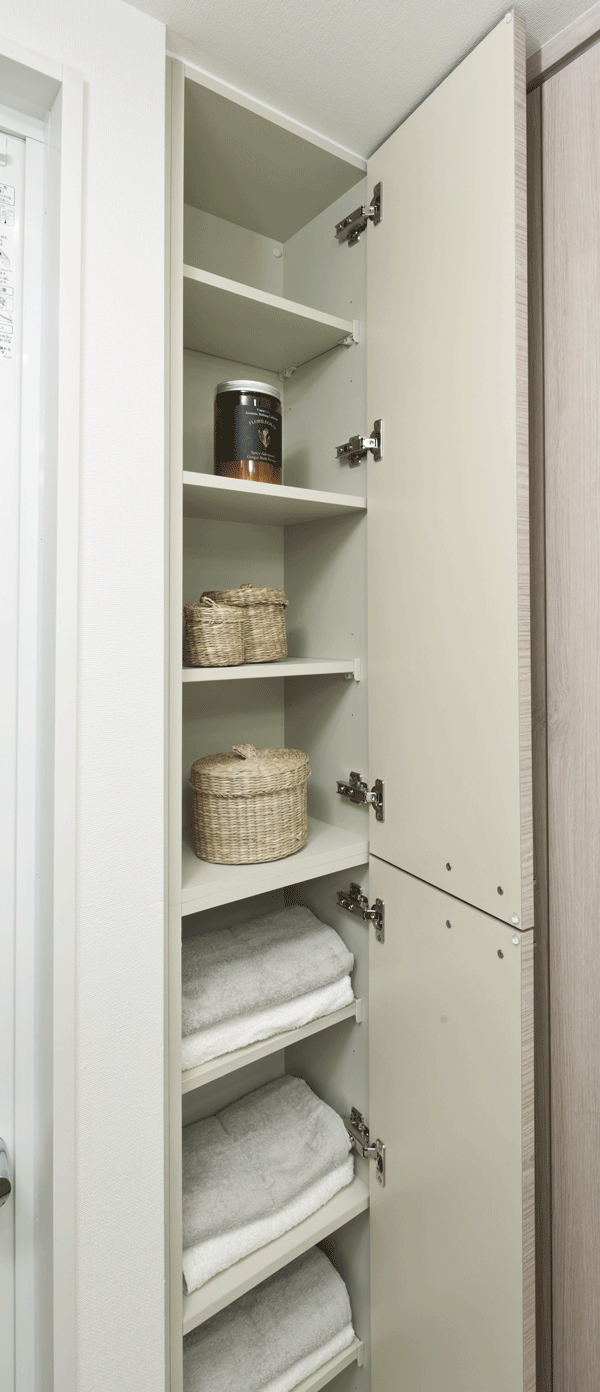 Bathing-wash room.  [Linen cabinet] Convenient linen cabinet has provided in the powder room for storage, such as towels (same specifications)