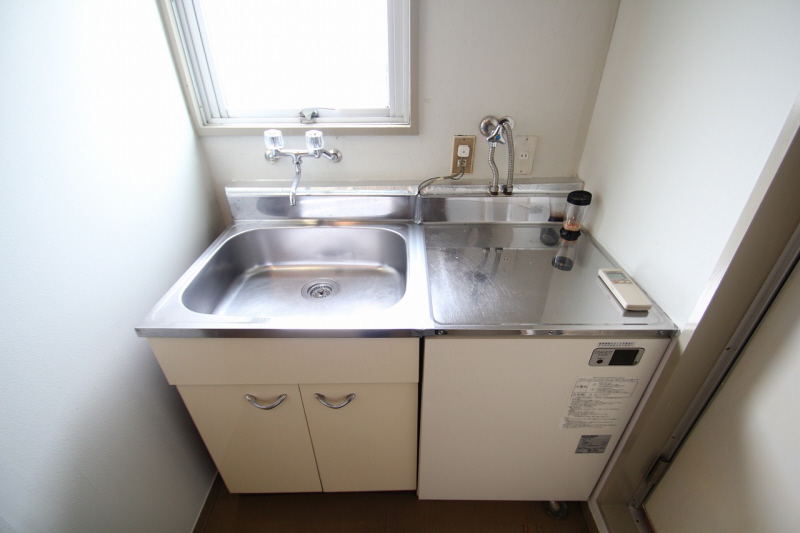 Kitchen. Put the two-burner electric stove.