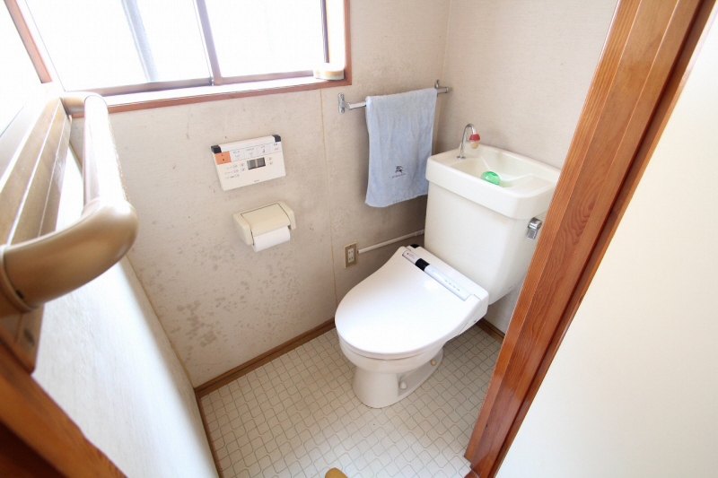 Toilet. It is with warm water washing toilet seat.