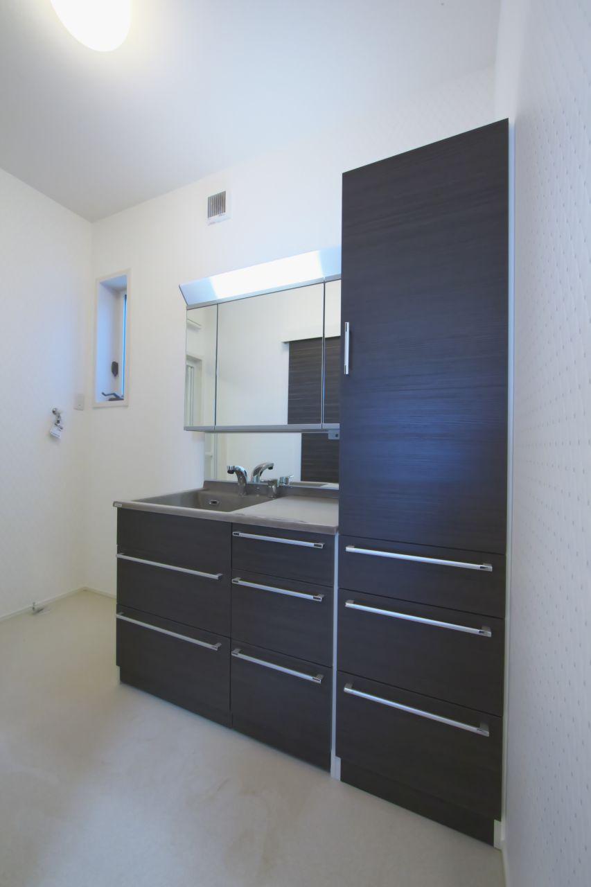 Wash basin, toilet. Washroom of simple design