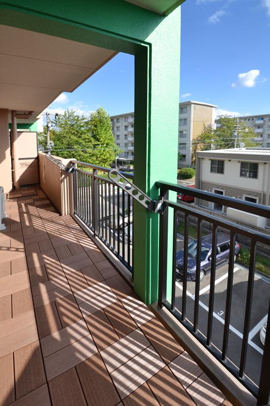 Balcony. Equipped with a wood deck is on the balcony