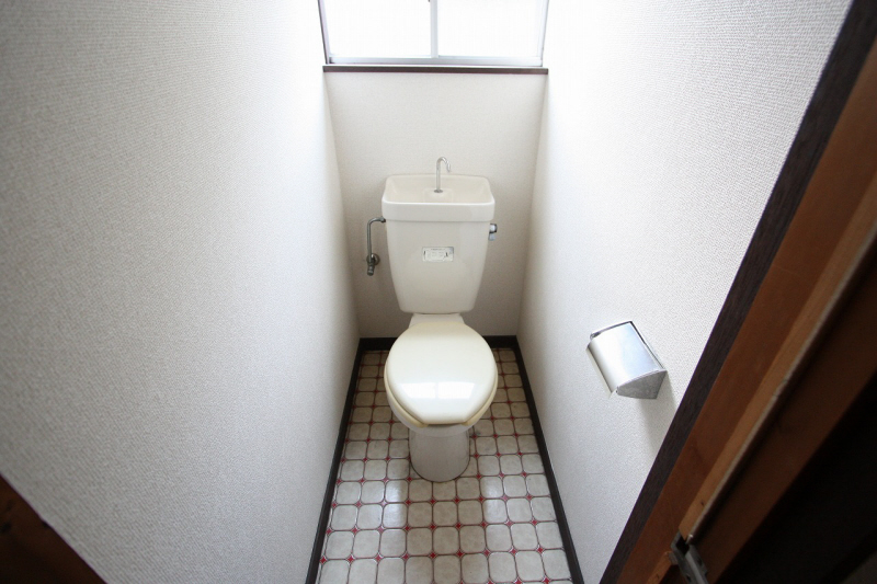 Toilet. It is a restroom with cleanliness. 