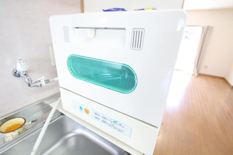 Other room space. Guy is wash dishes