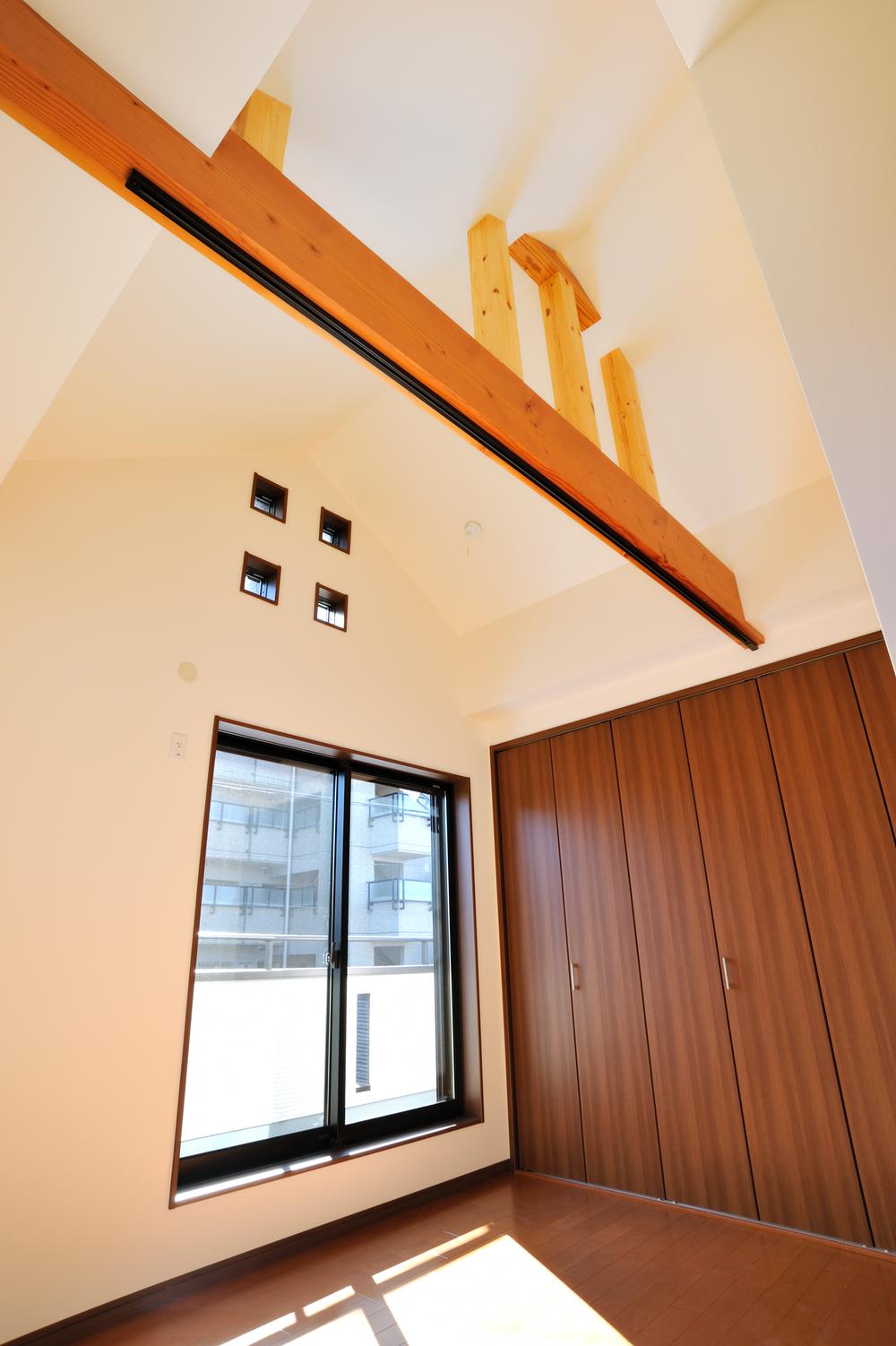 Non-living room. With a bold and stylish cosmetic beams in spacious space due to the high ceiling, Serene bedroom. 