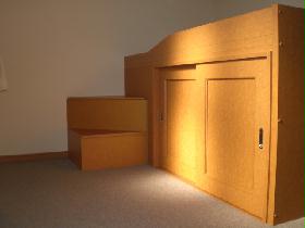Living and room. Under bet it has become a storage space