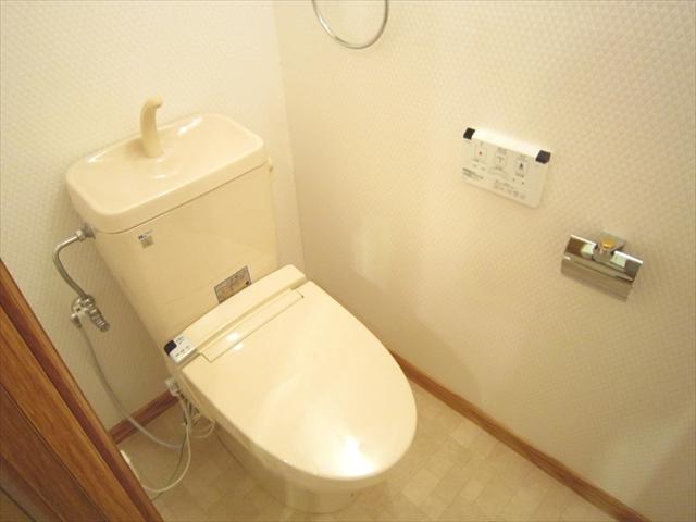 Toilet. It was exchanged a warm water washing toilet seat.