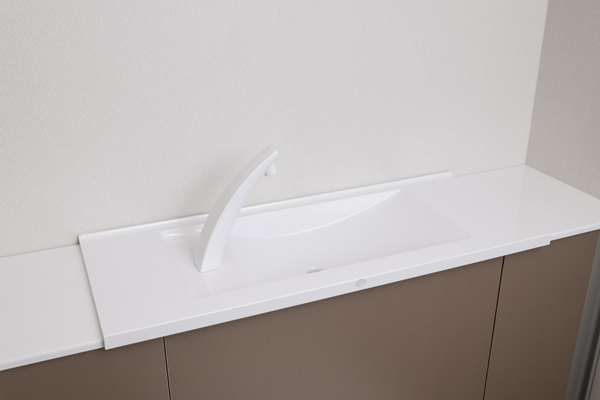 Toilet.  [Storage-integrated toilet and hand-washing counter] By utilizing the dead space of the tank sides, With a cabinet that can be stored is what you need to toilet. At the top it has a good hand washing counter user-friendly (same specifications)