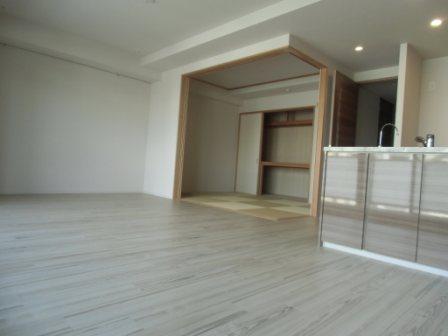 Living. I opened the sliding door of a Japanese-style room, The Ryukyu tatami accents features open-plan living-dining