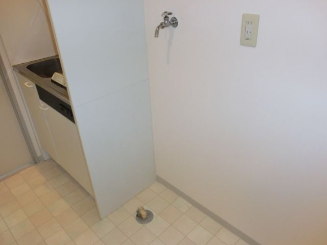 Kitchen. Laundry Area is located in the room. 