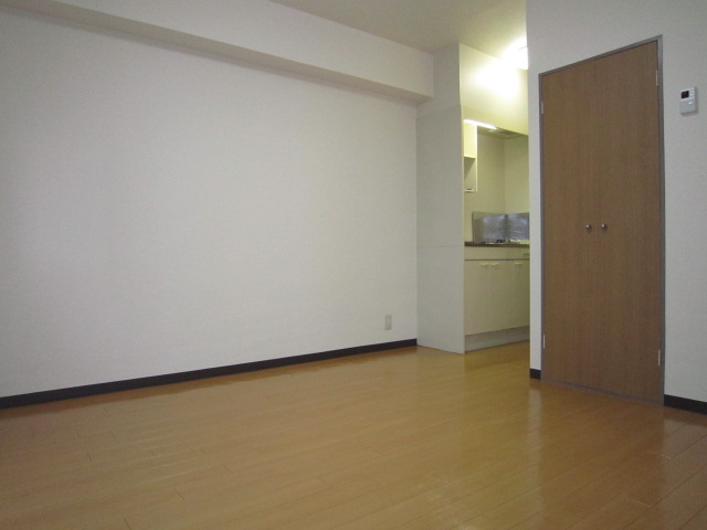 Living and room. There is a beautiful floor and the white cross is warmth of the wood grain