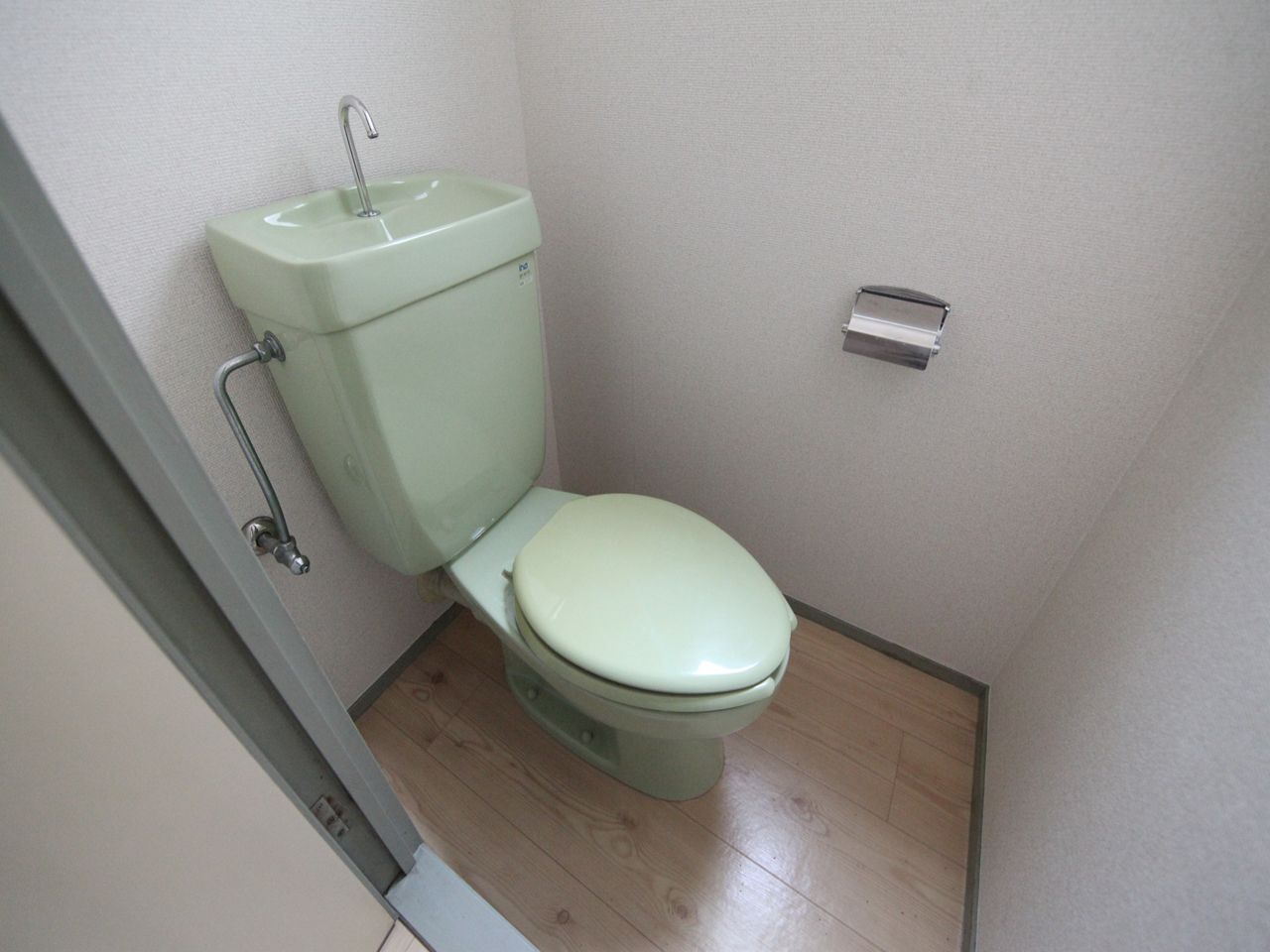 Toilet. Toilet (with warm water cleaning toilet seat attached)