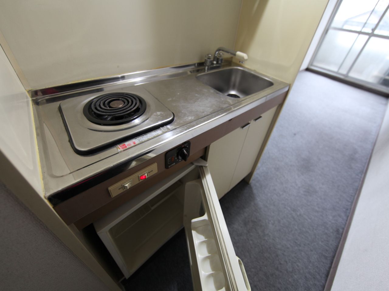 Kitchen. Kitchen (with electric stove) with a mini-fridge