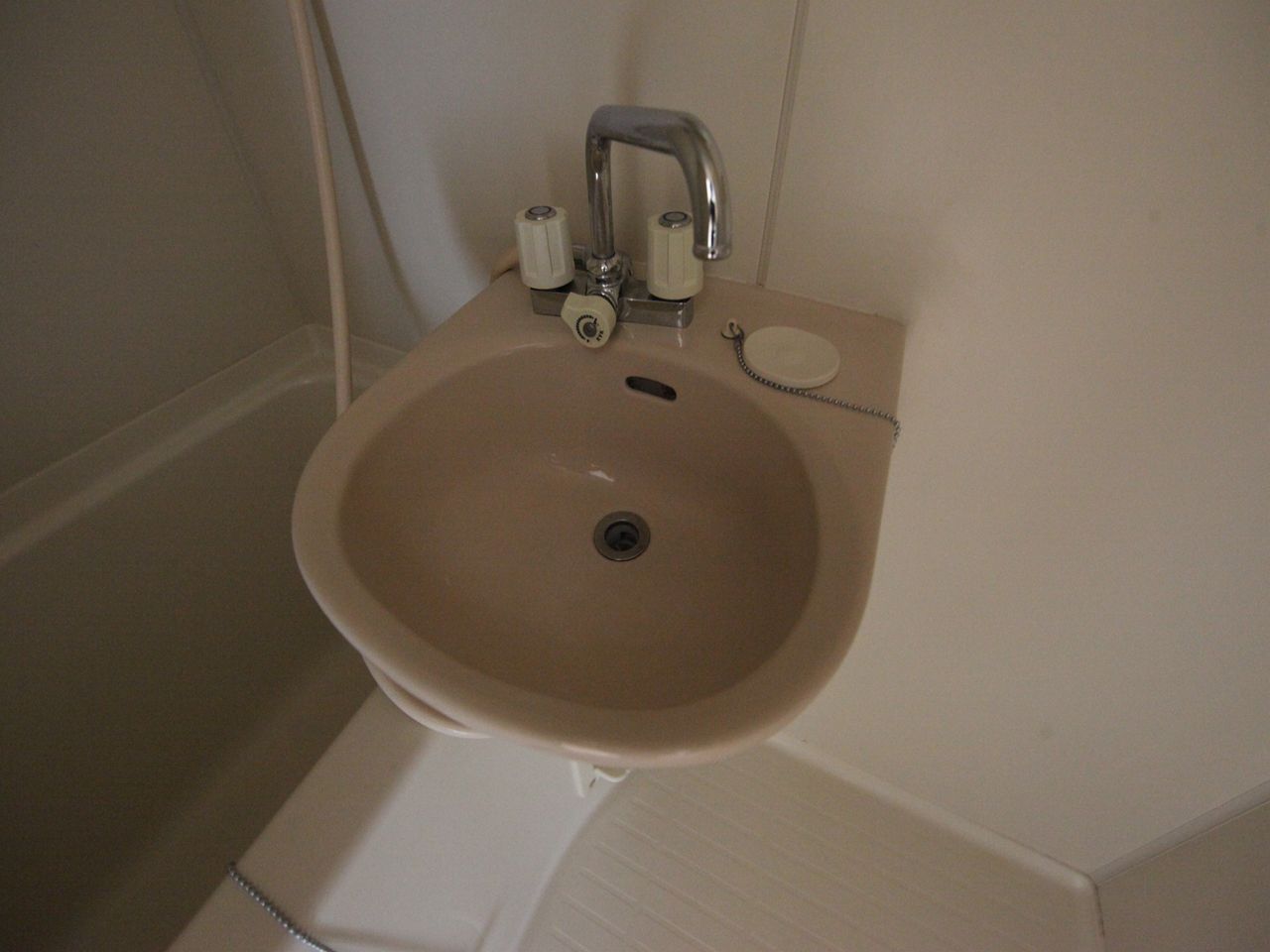 Washroom. Wash basin is attached to the bathroom