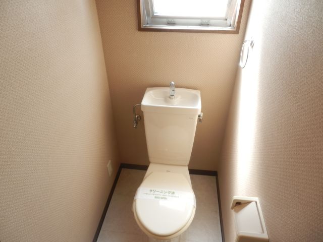 Toilet. It has a window to the toilet.