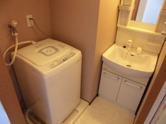 Washroom. It is a washing machine with