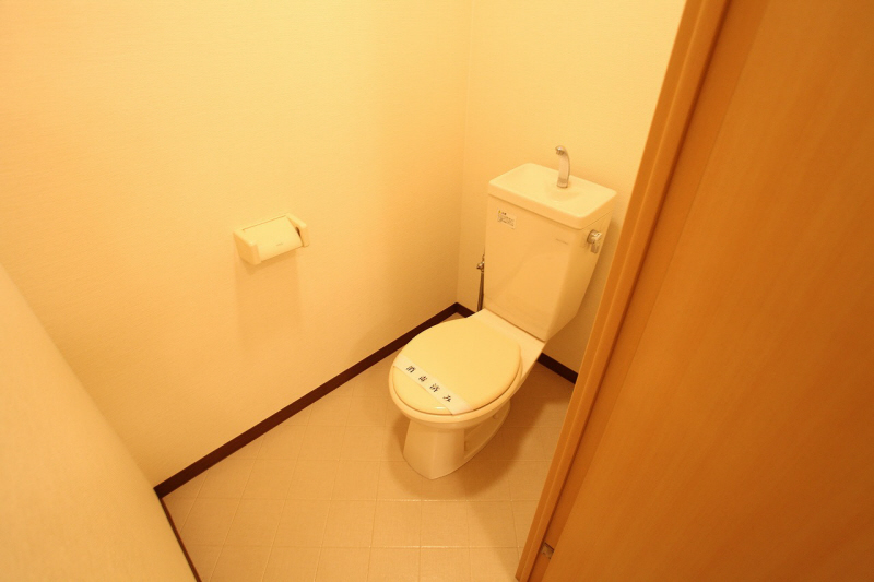 Toilet. It is a photograph of another in Room