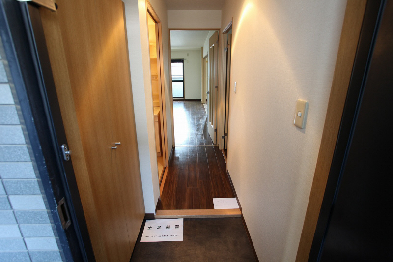 Entrance. It is a photograph of another in Room