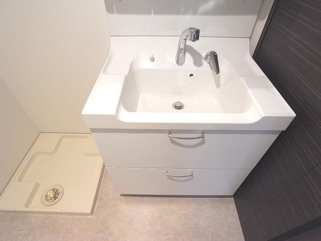 Washroom. Stylish wash basin of white